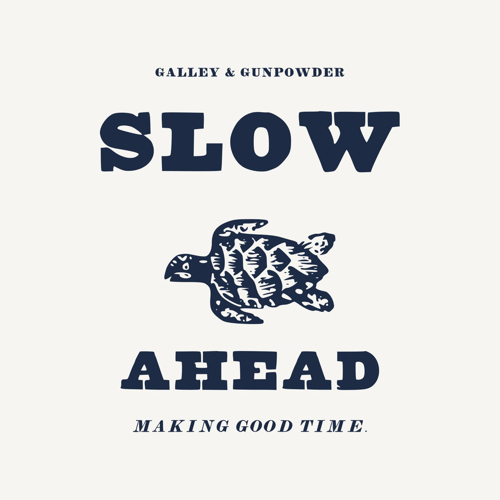 GALLEY & GUNPOWDER in small capitals, SLOW in fat slab letters, an engraved sea turtle, AHEAD below and MAKING GOOD TIME. in italics.