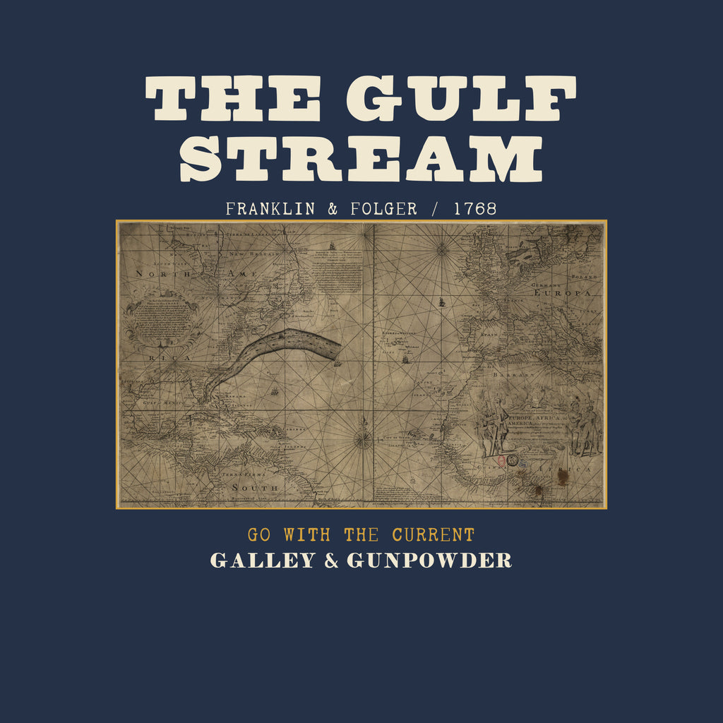 THE GULF STREAM in bold cream capitals over FRANKLIN & FOLGER / 1768, above Benjamin Franklin and Timothy Folger’s engraved chart of the North Atlantic with the Gulf Stream drawn as a dark band across it, framed in brass, with GO WITH THE CURRENT in brass and GALLEY & GUNPOWDER below.
