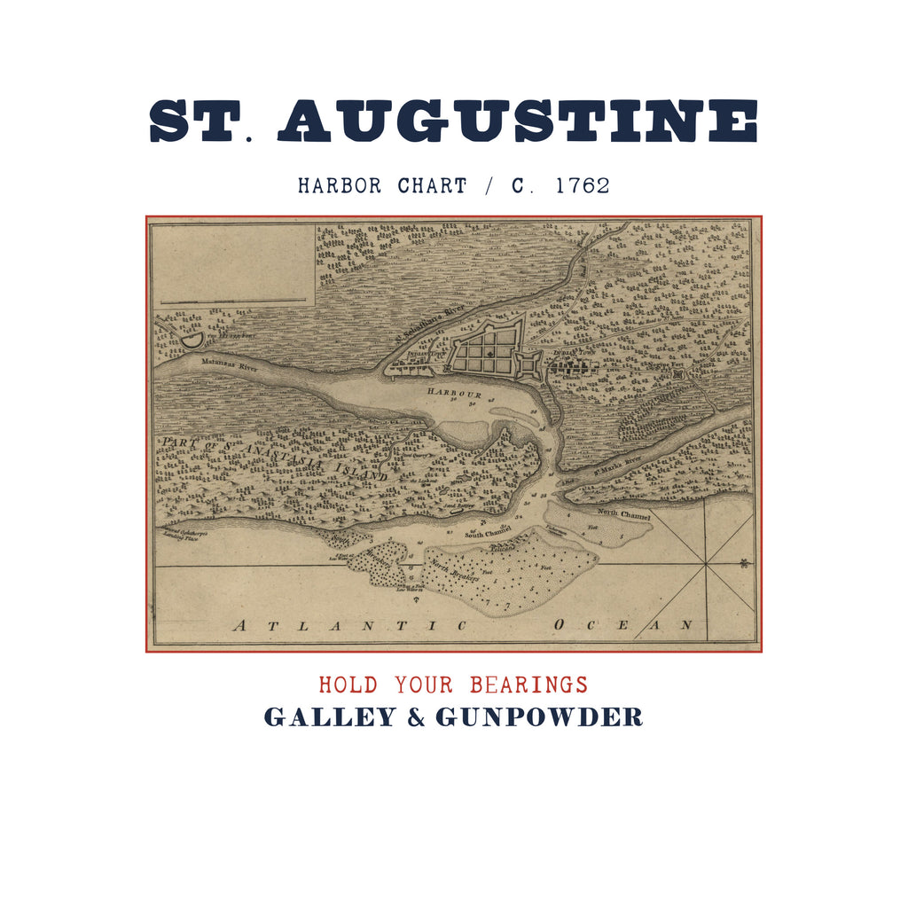 ST. AUGUSTINE in bold navy capitals over HARBOR CHART / C. 1762, above an engraved plan of the walled town and harbour of St. Augustine with Anastasia Island and the Atlantic Ocean, framed in red, with HOLD YOUR BEARINGS in red and GALLEY & GUNPOWDER in navy below.